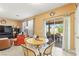 Open living area featuring tile floors, views to outdoor patio and comfortable seating at 7032 Wonderberry St, Las Vegas, NV 89131