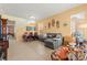 Spacious living room with tile flooring, comfortable seating, and access to the dining area at 7032 Wonderberry St, Las Vegas, NV 89131