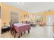 Bright living room featuring tile floors, neutral walls, dining area and ample natural light at 7032 Wonderberry St, Las Vegas, NV 89131