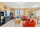 Cozy living room with tile flooring, comfortable seating and natural light from windows at 7032 Wonderberry St, Las Vegas, NV 89131