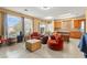Open-concept living space with tile floors, plenty of natural light and direct access to kitchen and backyard at 7032 Wonderberry St, Las Vegas, NV 89131