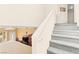 Staircase leading to second floor, showcasing open layout with view of living room at 7032 Wonderberry St, Las Vegas, NV 89131