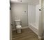 Bathroom featuring a toilet, and a bathtub with a white tile surround and black hardware at 8101 W Flamingo Rd # 1102, Las Vegas, NV 89147