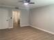 A light-filled bedroom with neutral walls and plank flooring offers an ensuite bathroom at 8101 W Flamingo Rd # 1102, Las Vegas, NV 89147