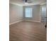 A bright bedroom features light wood floors, neutral walls, and a ceiling fan at 8101 W Flamingo Rd # 1102, Las Vegas, NV 89147