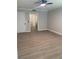 A light-filled bedroom with neutral walls and plank flooring offers an ensuite bathroom at 8101 W Flamingo Rd # 1102, Las Vegas, NV 89147