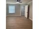 A bright bedroom features light wood floors, neutral walls, and a ceiling fan at 8101 W Flamingo Rd # 1102, Las Vegas, NV 89147