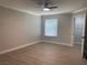 A bright bedroom features light wood floors, neutral walls, and a ceiling fan at 8101 W Flamingo Rd # 1102, Las Vegas, NV 89147