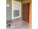 Condo entrance with bench and door, shows green wall with textured tan trim at 8101 W Flamingo Rd # 1102, Las Vegas, NV 89147