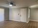 Bright living room featuring hardwood floors, ceiling fan, and natural light at 8101 W Flamingo Rd # 1102, Las Vegas, NV 89147