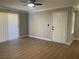 Bright living room featuring hardwood floors, ceiling fan, and natural light at 8101 W Flamingo Rd # 1102, Las Vegas, NV 89147
