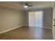 Empty living room showcasing wood flooring, white trim, and ceiling fan with light at 8101 W Flamingo Rd # 1102, Las Vegas, NV 89147