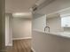 Open-concept layout with hardwood floors and kitchen pass-through at 8101 W Flamingo Rd # 1102, Las Vegas, NV 89147