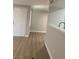 Open-concept layout with hardwood floors and kitchen pass-through at 8101 W Flamingo Rd # 1102, Las Vegas, NV 89147