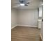 Open-concept layout with hardwood floors and partial view of kitchen at 8101 W Flamingo Rd # 1102, Las Vegas, NV 89147