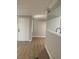 Open-concept layout with hardwood floors and kitchen pass-through at 8101 W Flamingo Rd # 1102, Las Vegas, NV 89147