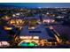 Expansive aerial view of a home with a pool, solar panels and an outdoor patio in a well-lit neighborhood at 8149 Villa De La Playa St, Las Vegas, NV 89131