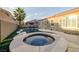 Inviting backyard with a pool, spa, and lush landscaping, perfect for outdoor relaxation and entertaining at 8149 Villa De La Playa St, Las Vegas, NV 89131