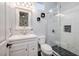 Bathroom with marble tile, glass enclosed shower, and modern vanity at 8149 Villa De La Playa St, Las Vegas, NV 89131