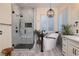 Bright bathroom featuring a freestanding tub and walk-in shower at 8149 Villa De La Playa St, Las Vegas, NV 89131