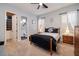 This bedroom features a walk-in closet, two windows, and a ceiling fan at 8149 Villa De La Playa St, Las Vegas, NV 89131