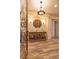 Bright foyer featuring decorative door, elegant chandelier, and console table with stylish decor at 8149 Villa De La Playa St, Las Vegas, NV 89131