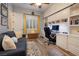 A home office featuring custom built-ins and a rolling library ladder at 8149 Villa De La Playa St, Las Vegas, NV 89131