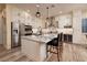 Elegant kitchen with a large island, granite countertops, stainless steel appliances, and plenty of cabinet space at 8149 Villa De La Playa St, Las Vegas, NV 89131