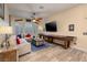 Relaxing living room with comfortable seating, entertainment center, and natural light at 8149 Villa De La Playa St, Las Vegas, NV 89131