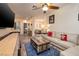 Open-concept living room with comfortable seating and access to the dining area at 8149 Villa De La Playa St, Las Vegas, NV 89131