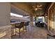 Outdoor kitchen featuring a built-in grill and covered patio with bar seating at 8149 Villa De La Playa St, Las Vegas, NV 89131