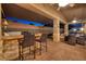 The covered patio has a built-in bar and seating area for entertaining with a view of the backyard at 8149 Villa De La Playa St, Las Vegas, NV 89131