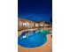 Inviting backyard pool with lush landscaping and patio area, perfect for outdoor entertaining and relaxation at 8149 Villa De La Playa St, Las Vegas, NV 89131