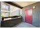 Covered balcony with room for seating and a door to a unit at 8600 W Charleston Blvd # 1059, Las Vegas, NV 89117