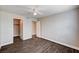 This bedroom features an adjoining closet, a door, and wood-like flooring at 8600 W Charleston Blvd # 1059, Las Vegas, NV 89117