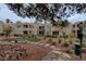 Well-maintained courtyard with lush landscaping, a seating area, and convenient pet waste station for residents' convenience at 8600 W Charleston Blvd # 1059, Las Vegas, NV 89117