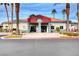 Exterior building with palm trees and landscaping on a sunny day at 8600 W Charleston Blvd # 1059, Las Vegas, NV 89117