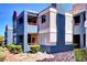 Attractive building exterior featuring colorful accents, private balconies, and meticulously maintained landscaping at 8600 W Charleston Blvd # 1059, Las Vegas, NV 89117