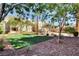 Well-maintained greenspace with seating area, landscaping, and mature trees, perfect for outdoor enjoyment and relaxation at 8600 W Charleston Blvd # 1059, Las Vegas, NV 89117