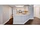 Cozy kitchen with white cabinets, a skylight and light countertops at 8600 W Charleston Blvd # 1059, Las Vegas, NV 89117
