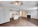 Open concept living room with fireplace, kitchen and modern hard wood floors at 8600 W Charleston Blvd # 1059, Las Vegas, NV 89117