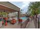 Community pool area with seating, landscaping, and shade for a relaxing outdoor experience at 8600 W Charleston Blvd # 1059, Las Vegas, NV 89117