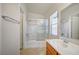 Bathroom with a tub-shower combo, single sink vanity, and a window for natural light at 8768 Tom Noon Ave # 101, Las Vegas, NV 89178