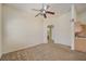 Bright, carpeted bedroom with ensuite bathroom and ample space for flexible living at 8768 Tom Noon Ave # 101, Las Vegas, NV 89178