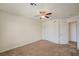 Bedroom features neutral carpet, ceiling fan, and has a sliding door closet at 8768 Tom Noon Ave # 101, Las Vegas, NV 89178