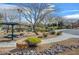 Picturesque common area with picnic tables, mature landscaping, and a walking path at 8768 Tom Noon Ave # 101, Las Vegas, NV 89178