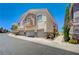 Inviting multi-story townhome with a private balcony, attached garage, and neat landscaping at 8768 Tom Noon Ave # 101, Las Vegas, NV 89178