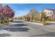 Community entrance with decorative brick columns and secure gated access for residents at 8768 Tom Noon Ave # 101, Las Vegas, NV 89178