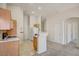 Bright eat-in kitchen with wood cabinets, a breakfast bar, and white appliances at 8768 Tom Noon Ave # 101, Las Vegas, NV 89178
