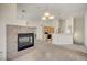 Open concept living room featuring a fireplace that flows into the kitchen with ample space at 8768 Tom Noon Ave # 101, Las Vegas, NV 89178